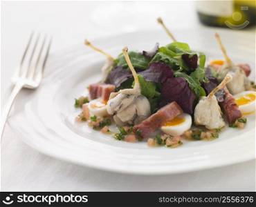Salad of Frog Legs Lardons and Quail Eggs