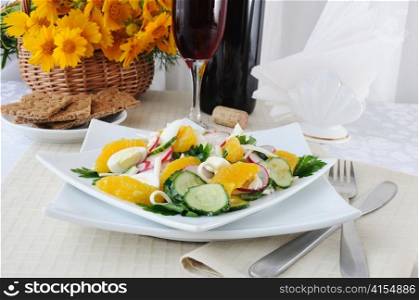Salad of radish and cucumber with egg, cheese and orange