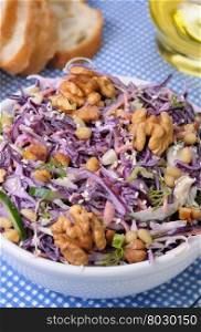 salad of shredded red cabbage with nuts in milk sauce