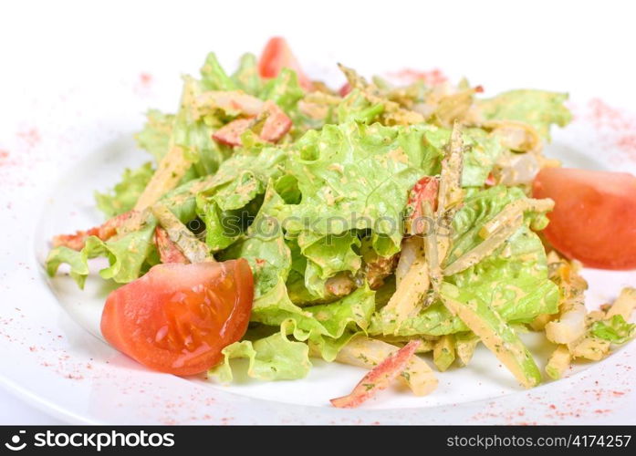 Salad of squid with roast chicken meat, apples, tomatoes, eggs and peppers