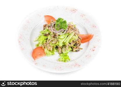 Salad of squid with roast chicken meat, apples, tomatoes, eggs and peppers