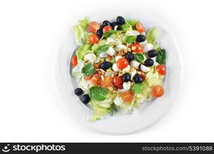 salad of vegetables with cheese and seeds on plate