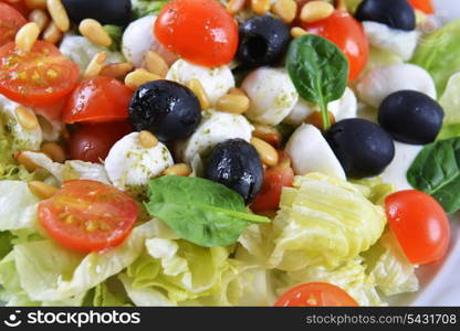 salad of vegetables with cheese and seeds on plate