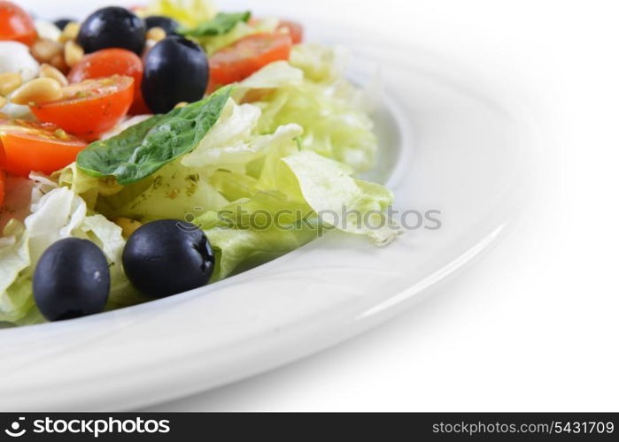 salad of vegetables with cheese and seeds on plate