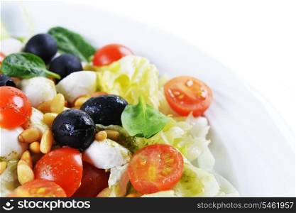 salad of vegetables with cheese and seeds on plate
