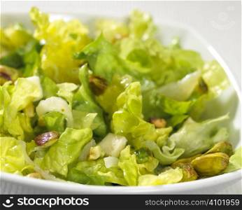 salad plate with nuts isolated on white