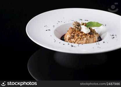 salad puree in a plate on a black background. dish on black background