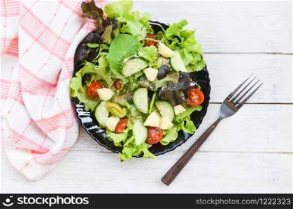 Salad vegetable / salad with fruit and fresh lettuce tomato cucumber on plate on table healthy food eating concept , top view