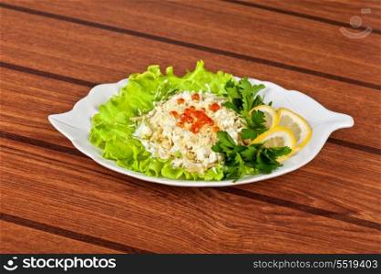 Salad with apples, eggs, cheese, caviar and greens