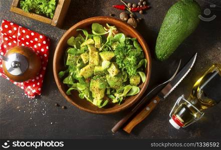 salad with avocado and nuts in bowl