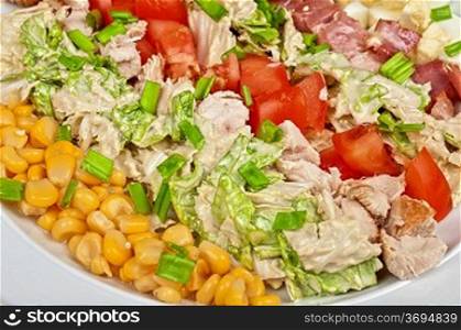 Salad with bacon, chicken, tomato, eggs and corn