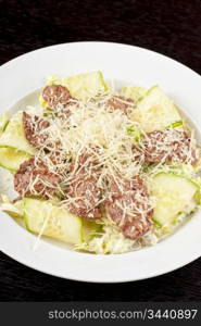 Salad with beef, lettuce, cucumber, string beans, Chinese cabbage and sauce