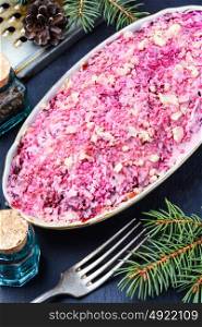 Salad with beets and herring. Traditional Russian dish salad with herring, mayonnaise and beetroot