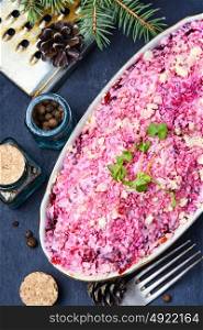 Salad with beets and herring. Traditional Russian dish salad with herring, mayonnaise and beetroot