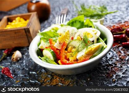 Salad with boiled egg, pepper, arugula and corn