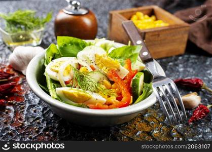 Salad with boiled egg, pepper, arugula and corn