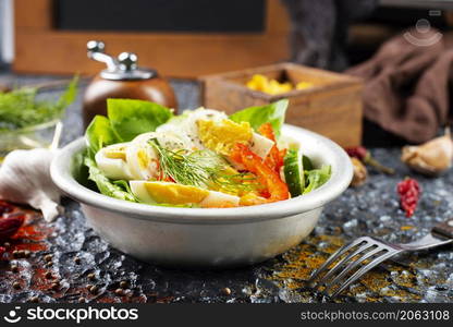 Salad with boiled egg, pepper, arugula and corn