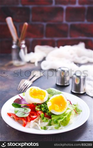 salad with boiled eggs on the plate