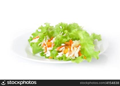 Salad with cabbage, carrots and raisins, wrapped in lettuce leaves