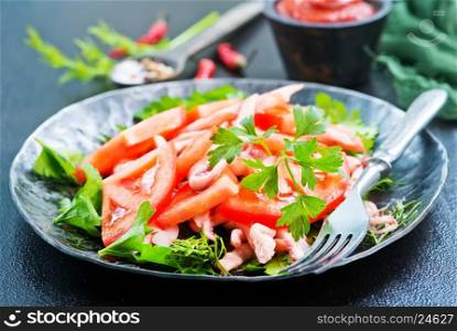 salad with calamari on plate and on a table