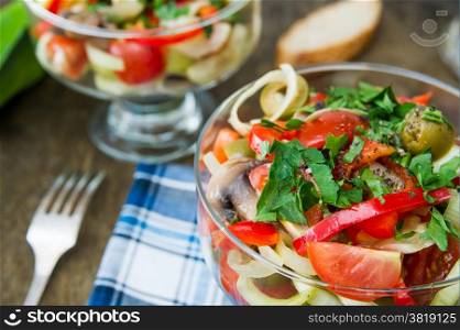 salad with cherry tomatoes, mushrooms, sweet peppers and leeks. Italian food