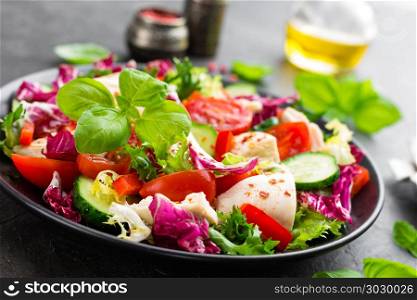 Salad with chicken meat. Fresh vegetable salad with chicken breast. Meat salad with chicken fillet and fresh vegetables on plate