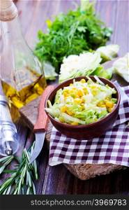 salad with corn in bowl and on a table