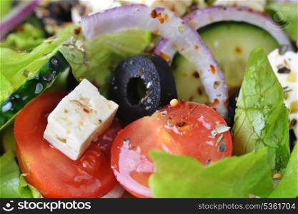 salad with feta cheese and fresh vegetables close up