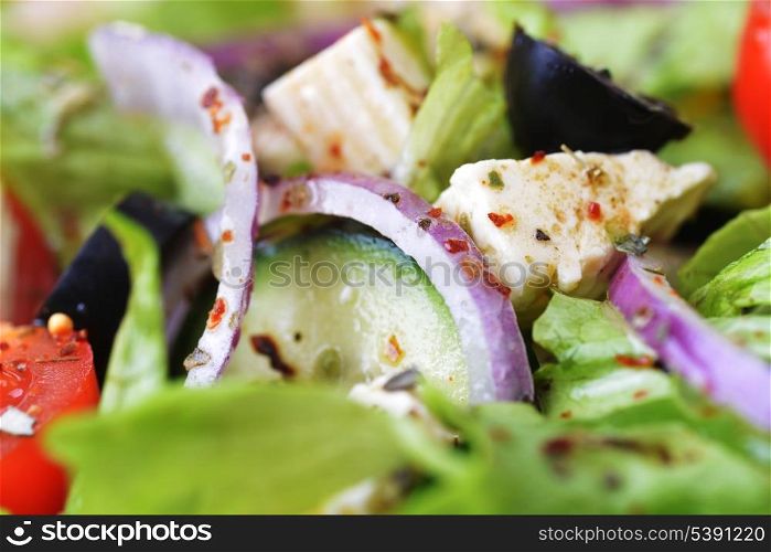 salad with feta cheese and fresh vegetables close up