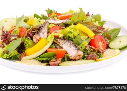 Salad with fish and fresh vegetables on white background.