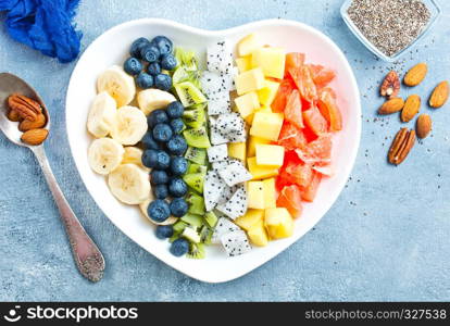 salad with fresh berries and fruits in bowl