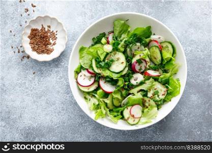 Salad with fresh green lettuce, radish and cucumber