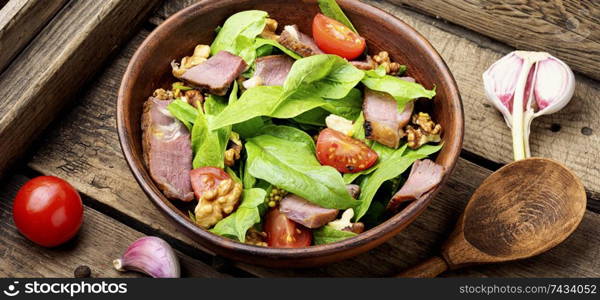 Salad with fresh herbs.Salad with spinach,bacon and sorrel.Healthy food. Salad with meat,spinach and sorrel