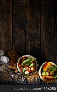 salad with fresh tomato and cucumber in bowls