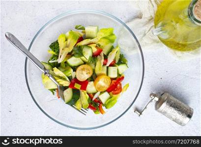 salad with fresh tomato and cucumbers in bowl