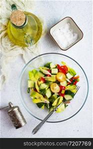 salad with fresh tomato and cucumbers in bowl