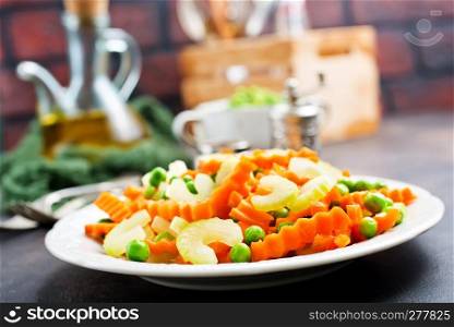 salad with fresh vegetables. salad with celery carrot peas