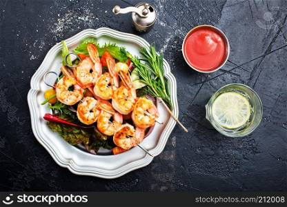 salad with fried shrimps on plate, fresh salad