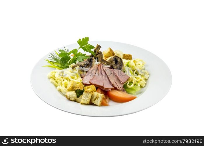 Salad with ham, mushrooms, tomatoes and pasta on an isolated background