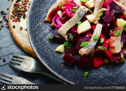 Salad with herring,beets,onions and green peas.Traditional russian salad. Appetizing herring salad