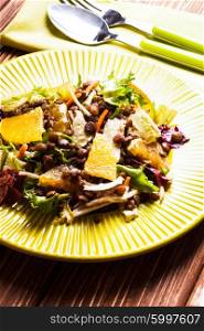 Salad with lentils, carrot, orange and green leaves