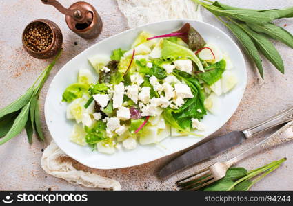 salad with oil and cheese in the bowl