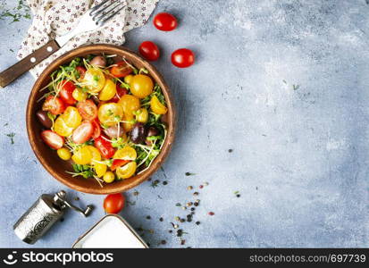 salad with olives, oil and fresh tomato