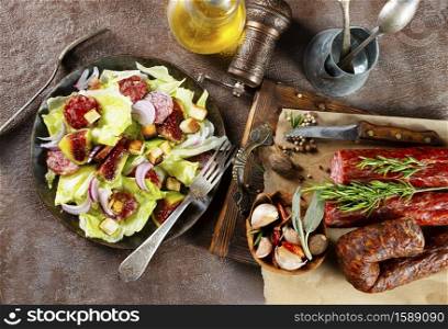 salad with salami and fresh fig on plate