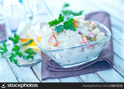 salad with seafood in bowl on a table
