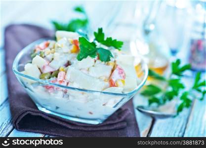 salad with seafood in bowl on a table