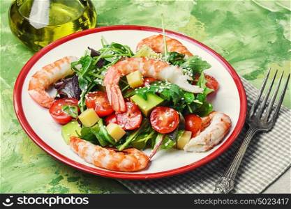 Salad with shrimp,tomatoes and avocado. spring salad with large shrimp,avocado,tomato and greens