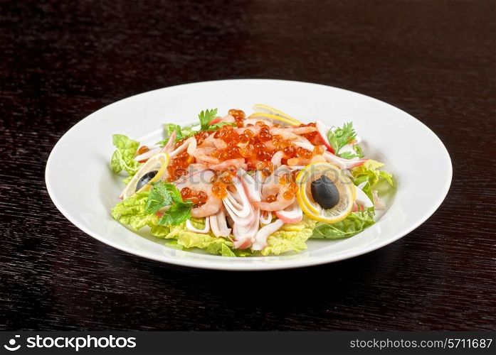 Salad with shrimps, caviar, calamaries and lettuce