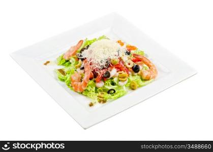 Salad with shrimps, caviar, calamaries, lettuce, olive, tomato and mozzarella