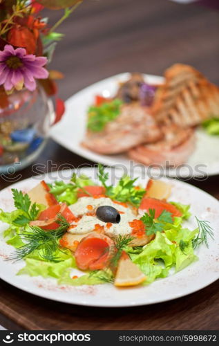 salad with smoked salmon . vegetable salad with smoked salmon